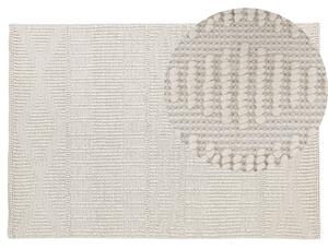 Ręcznie tkany dywan wełniany geometryczny wzór 140 x 200 cm beżowy Lapseki Beliani