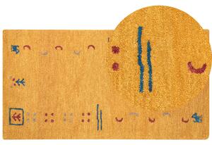 Dywan wełniany z wzorem ręcznie wykonany 80 x 150 cm żółty Akalan Beliani