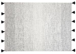 Nowoczesny dywan wełniany ozdobny frędzle 140 x 200 cm czarno-biały Gemlik Beliani
