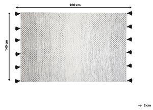 Nowoczesny dywan wełniany ozdobny frędzle 140 x 200 cm czarno-biały Gemlik Beliani