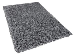 Puszysty dywan 140 x 200 cm czarno-biały poliestrowy chodnik shaggy Cide Beliani