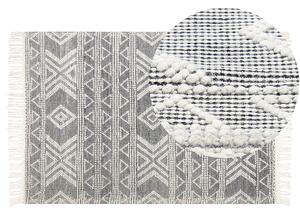Dywan wełniany ręcznie robiony wzór geometryczny z frędzlami 160 x 230 cm biało-czarny Pazar Beliani