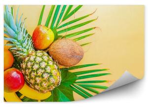 Tropikalne owoce kokos ananas liście żółte tło Fototapeta Tropikalne owoce kokos ananas liście żółte tło