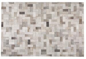 Nowoczesny dywan ze skóry bydlęcej do salonu szaro-beżowy 140 x 200 cm Korfez Beliani