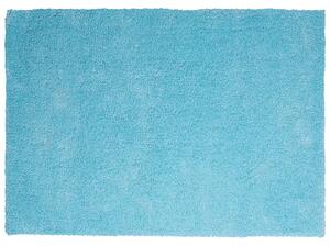 Nowoczesny dywan poliester niebieski gładki wykonany ręcznie 140 x 200 cm Demre Beliani