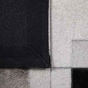 Dywan skórzany 160 x 230 cm wzór geometryczny ręcznie tkany czarno-szary Efirli Beliani