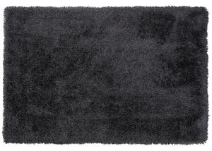 Puszysty dywan 140 x 200 cm czarny poliestrowy chodnik shaggy Cide Beliani