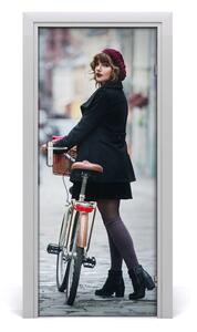 Fototapeta samoprzylepna DRZWI Kobieta na rowerze