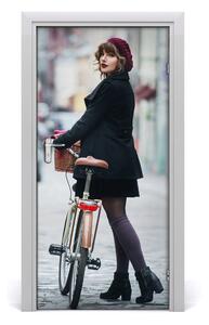 Fototapeta samoprzylepna DRZWI Kobieta na rowerze