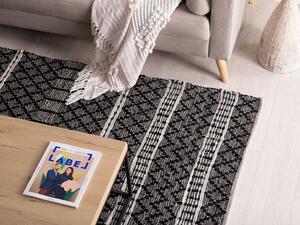 Dywan do salonu 140x200 cm skórzany z bawełną wzór geometryczny czarny Fehimli Beliani