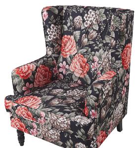 Klasyczny fotel uszak w kwiaty z podnóżkiem wygodny czarno-czerwony Sandset Beliani