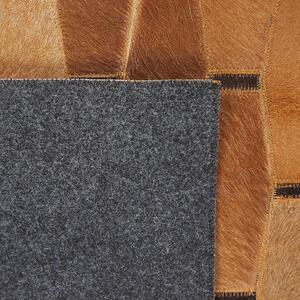 Dywan brązowy patchwork z łat skóra naturalna włochaty 140 x 200 cm Digor Beliani