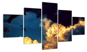 Obraz skoczka spadochronowego w chmurach (125x70 cm)