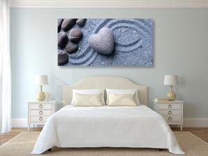 Obraz serce z kamienia na piaszczystym tle