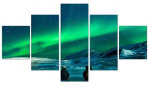 Obraz ludzi w pobliżu zorzy polarnej (125x70 cm)