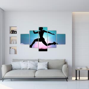 Obraz skaczącej sylwetki kobiety (125x70 cm)