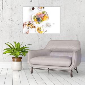 Obraz talerzy z owocami na stole (70x50 cm)