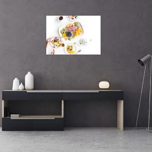 Obraz talerzy z owocami na stole (70x50 cm)