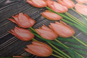 Obraz urocze pomarańczowe tulipany na drewnianym tle