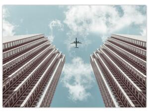 Obraz samolotu między budynkami (70x50 cm)