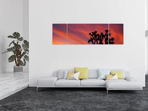 Obraz zachodu słońca nad sylwetką drzewa (170x50 cm)