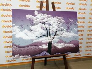 Obraz drzewo pokryte chmurami