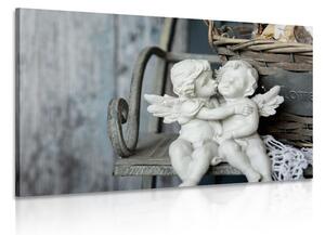 Obraz figurki aniołów na ławce