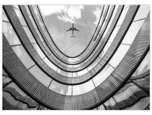 Obraz - Samolot nad budynkiem (70x50 cm)
