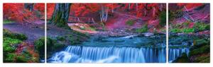 Obraz wodospadu w czerwonym lesie (170x50 cm)