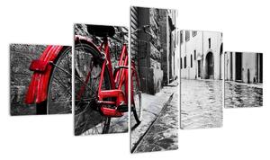 Obraz czerwonego roweru na brukowanej uliczce (125x70 cm)