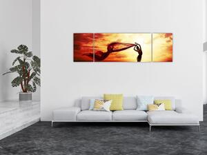 Obraz - Sylwetka kobiety o zachodzie słońca (170x50 cm)