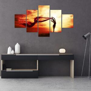 Obraz - Sylwetka kobiety o zachodzie słońca (125x70 cm)