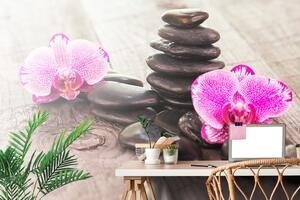 Fototapeta orchidea i zen kamienie na drewnie