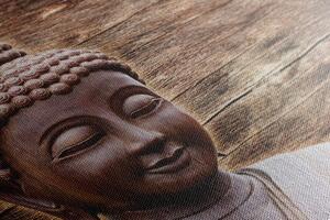 Obraz posąg Buddy na drewnianym tle