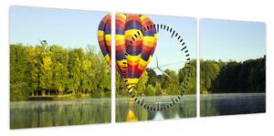 Obraz balonu na ogrzane powietrze nad jeziorem (z zegarem) (90x30 cm)
