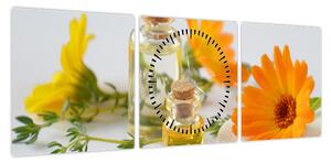 Obraz pomarańczowych kwiatów (z zegarem) (90x30 cm)