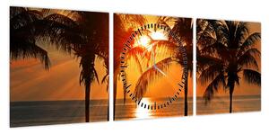 Obraz palmy o zachodzie słońca (z zegarem) (90x30 cm)