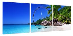 Obraz plaży na wyspie Praslin (z zegarem) (90x30 cm)