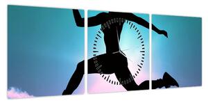 Obraz skaczącej sylwetki kobiety (z zegarem) (90x30 cm)
