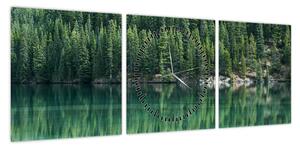 Obraz - drzewa iglaste nad jeziorem (z zegarem) (90x30 cm)