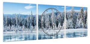 Obraz zamarzniętego jeziora i pokrytych śniegiem drzew (z zegarem) (90x30 cm)