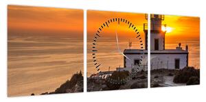 Obraz latarni morskiej o zachodzie słońca (z zegarem) (90x30 cm)