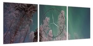 Obraz zorzy polarnej nad zamarzniętymi drzewami (z zegarem) (90x30 cm)