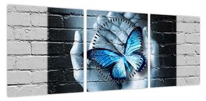 Obraz niebieskiego motyla na ścianie (z zegarem) (90x30 cm)