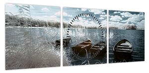 Obraz - Drewniane łodzie na jeziorze (z zegarem) (90x30 cm)