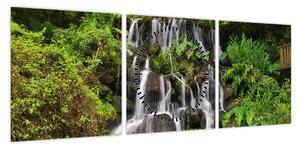 Obraz wodospadów w tropikalnym lesie (z zegarem) (90x30 cm)