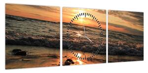 Obraz - Zachód słońca nad oceanem (z zegarem) (90x30 cm)