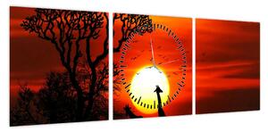 Obraz - Sylwetki zwierząt o zachodzie słońca (z zegarem) (90x30 cm)
