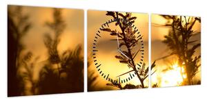 Obraz - słońce zachodzące za drzewami (z zegarem) (90x30 cm)