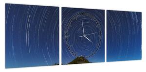 Obraz obracających się gwiazd (z zegarem) (90x30 cm)